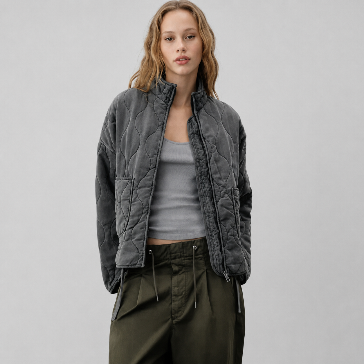 Women's quilted jacket with high collar and patch pockets